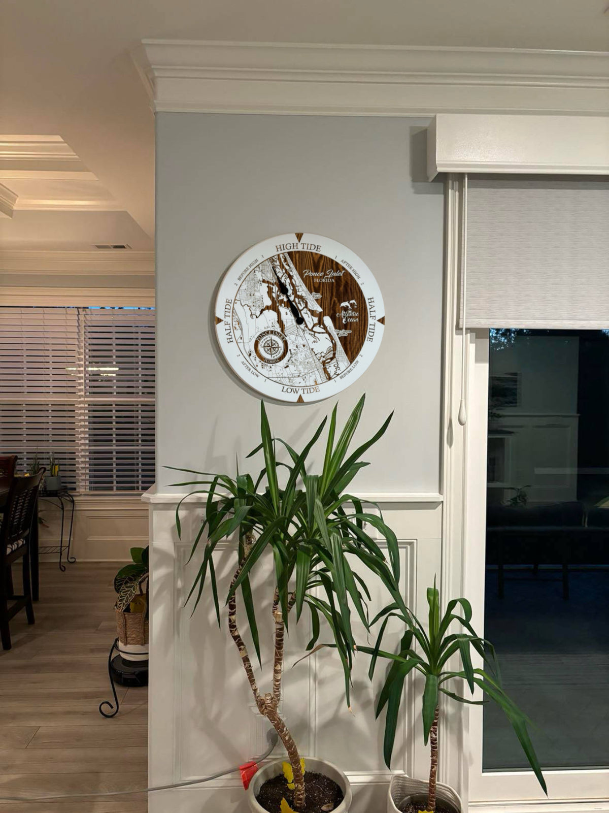 Ponce Inlet Florida tide clock displayed on a wall in a coastal home